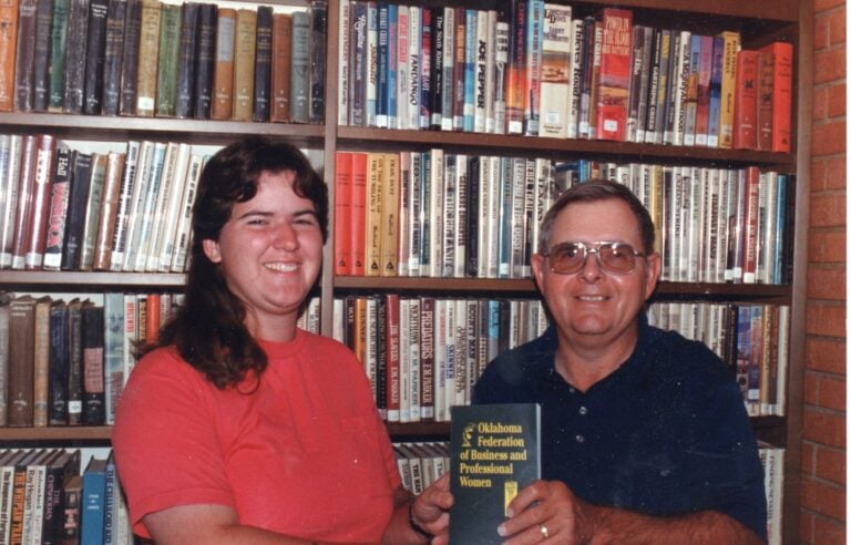 1993 Becky McCray presents Alva Library Larry Thorne a copy of the OK BPW history book